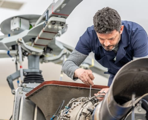 Global manufacturing specialization - aerospace engineer working on precision aircraft components representing America's manufacturing expertise