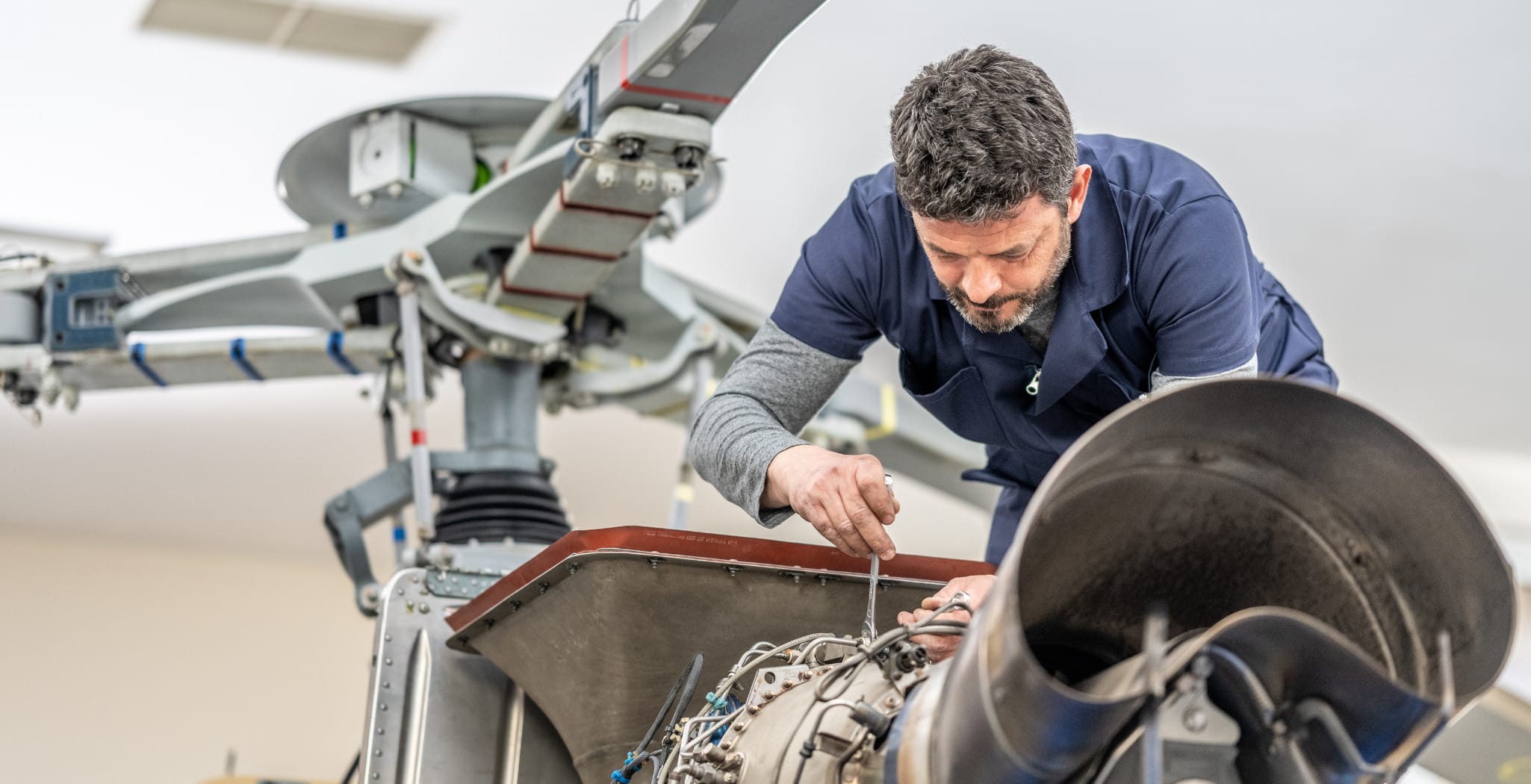 Global manufacturing specialization - aerospace engineer working on precision aircraft components representing America's manufacturing expertise