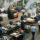 Factory floor representing contract manufacturing cost risks for PE-backed companies